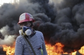 water-cannons-put-out-fires-while-tear-gas-and-stun-grenades-were-used-on-protesters